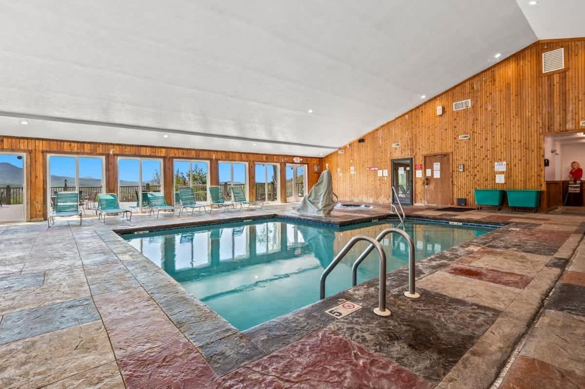 The building's shared indoor pool · © Above The Clouds