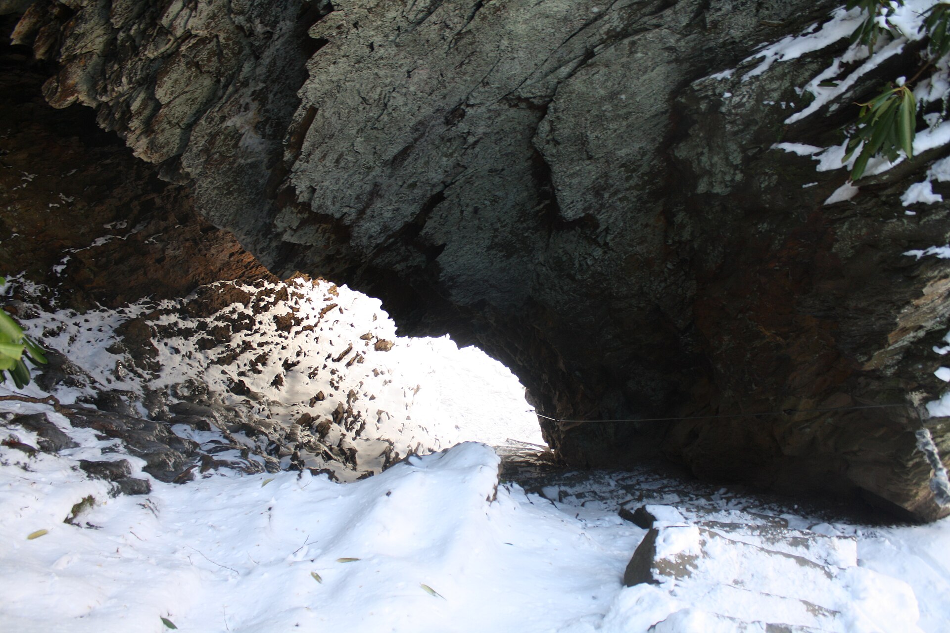Arch Rock under snow, where the trail passes through the rock