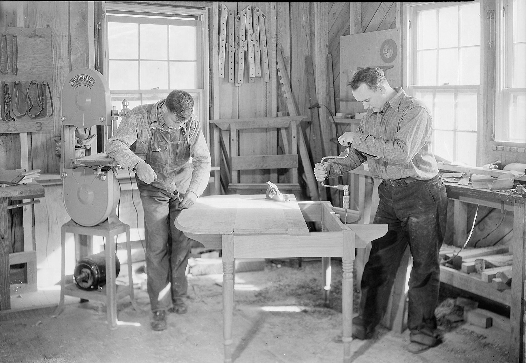 Woodcrafters building a drop-leaf table in a Gatlinburg shop, 1933