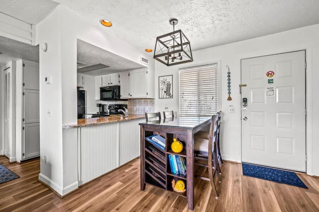 The galley kitchen and granite breakfast bar off the living room · © Blessed in the Smokies