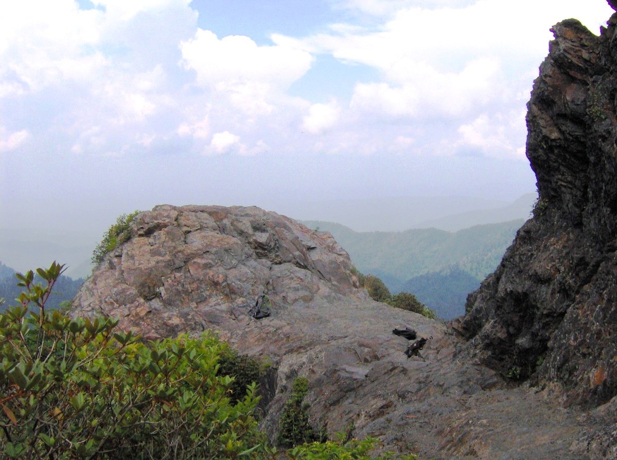 The boulder-like knob on the Bunion's north face, with hikers' packs at its base