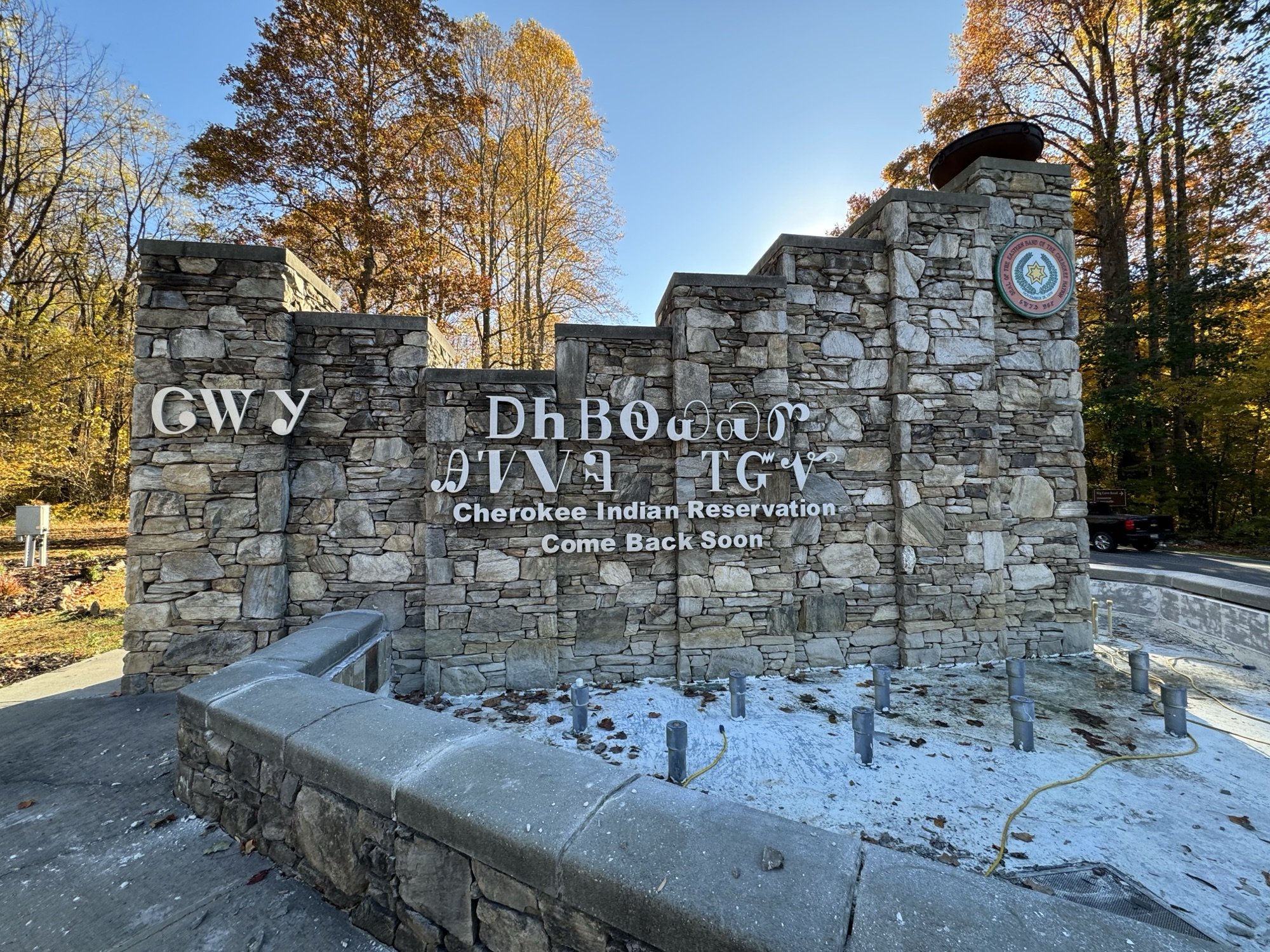 A stone sign in the Cherokee syllabary and English on the Qualla Boundary