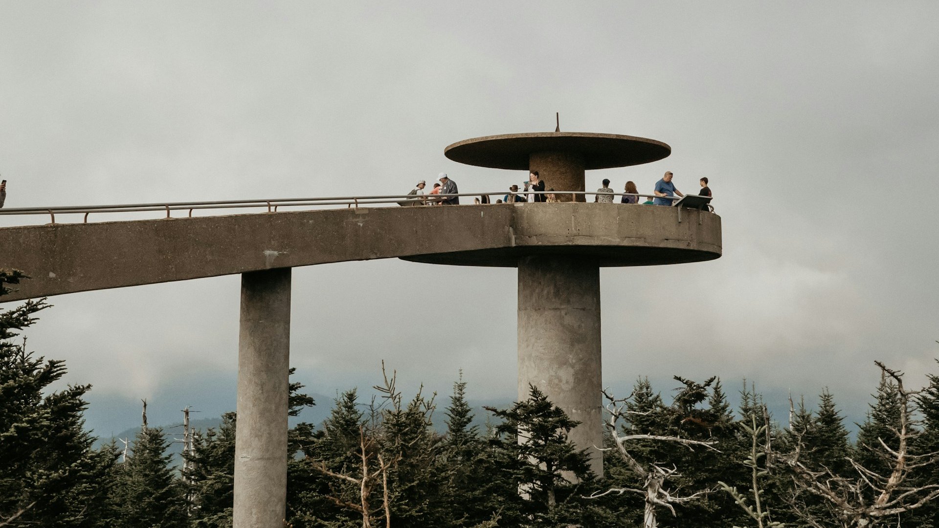 The Kuwohi observation tower and its ramp under a low cloud ceiling