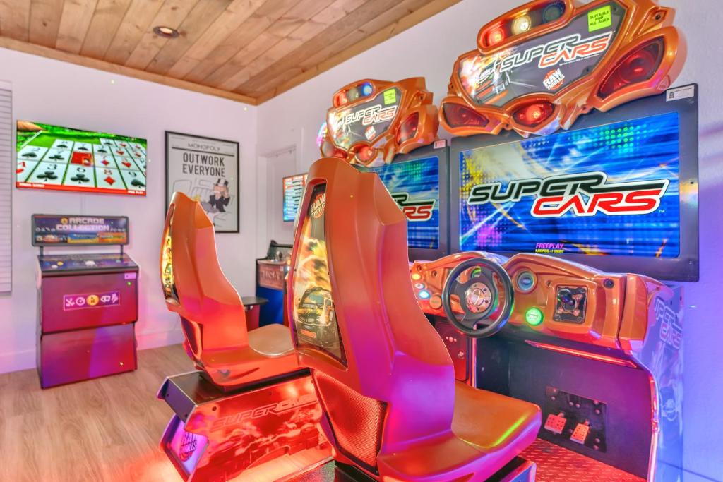 Twin arcade racing simulators in the game lounge · © Bear Necessities