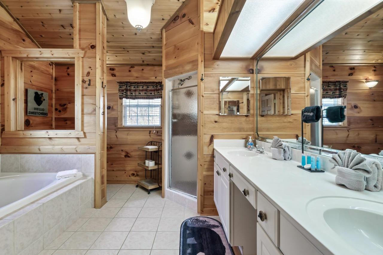 A corner soaking tub and double vanity in one of the two full baths · © Fireflies and Moonshine