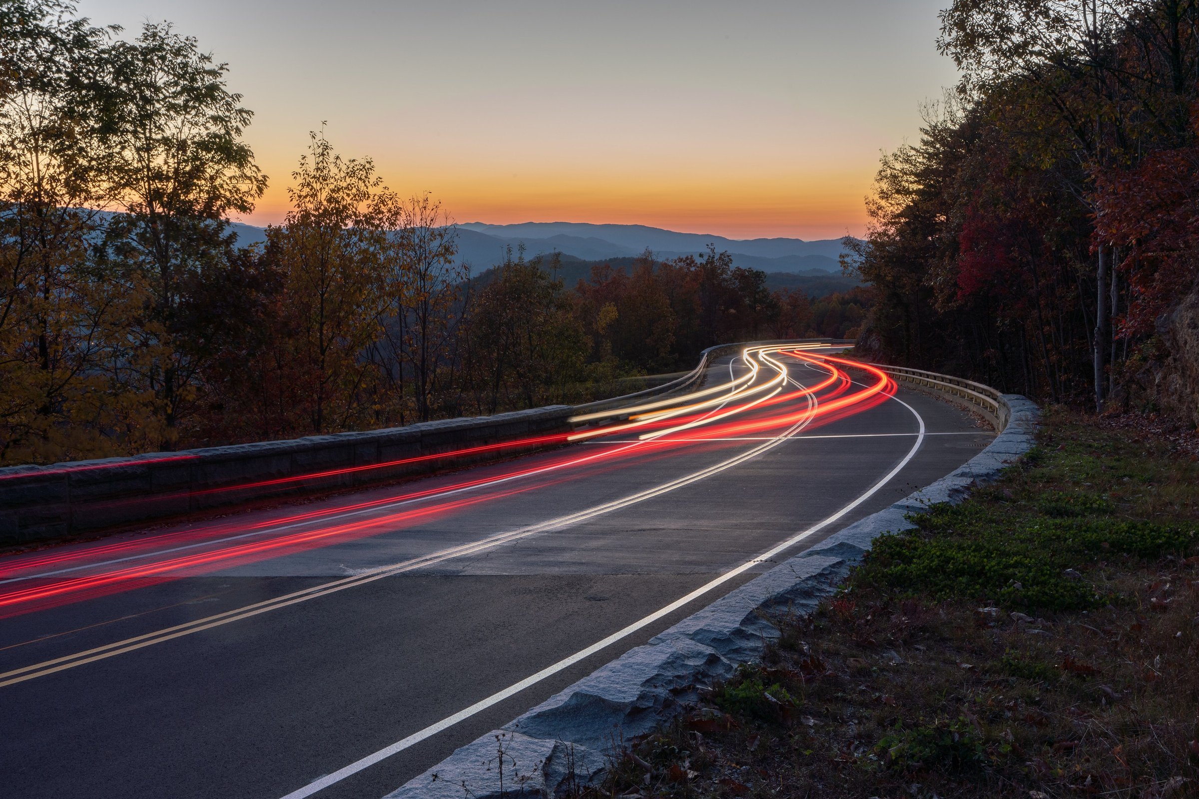 Headlights and taillights on the parkway at dusk