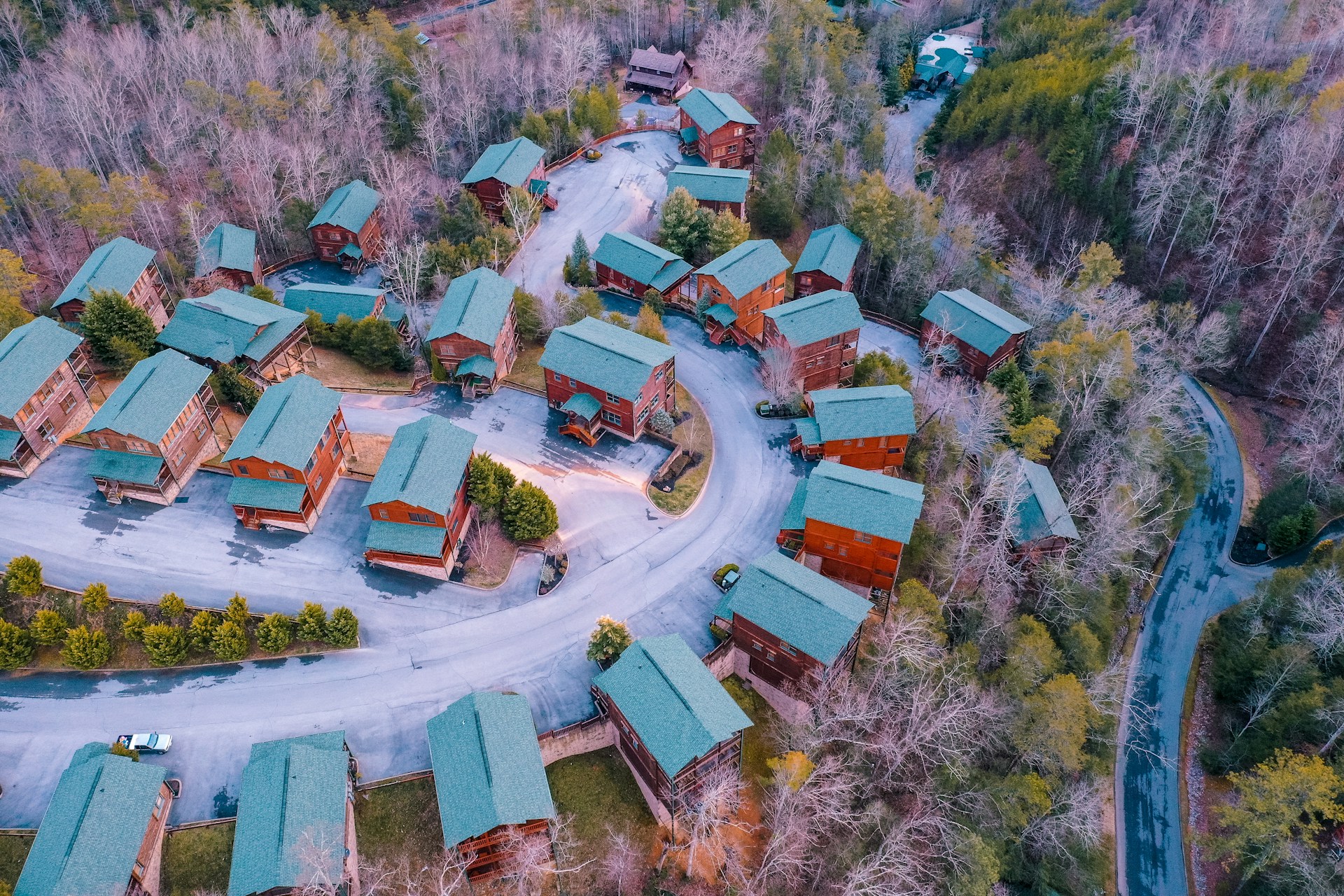 A cluster of log cabins in the woods around Gatlinburg, seen from the air