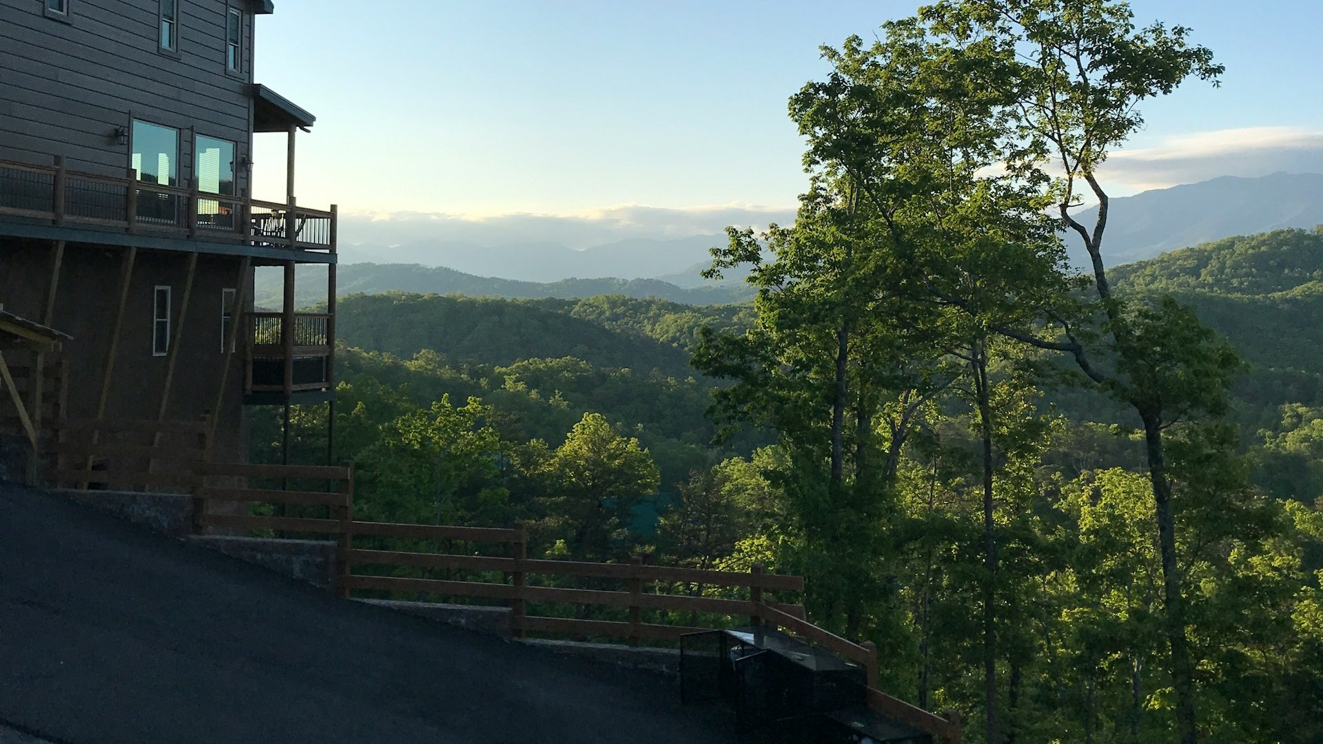 A hillside cabin, its sloping drive and the ridges beyond, Gatlinburg