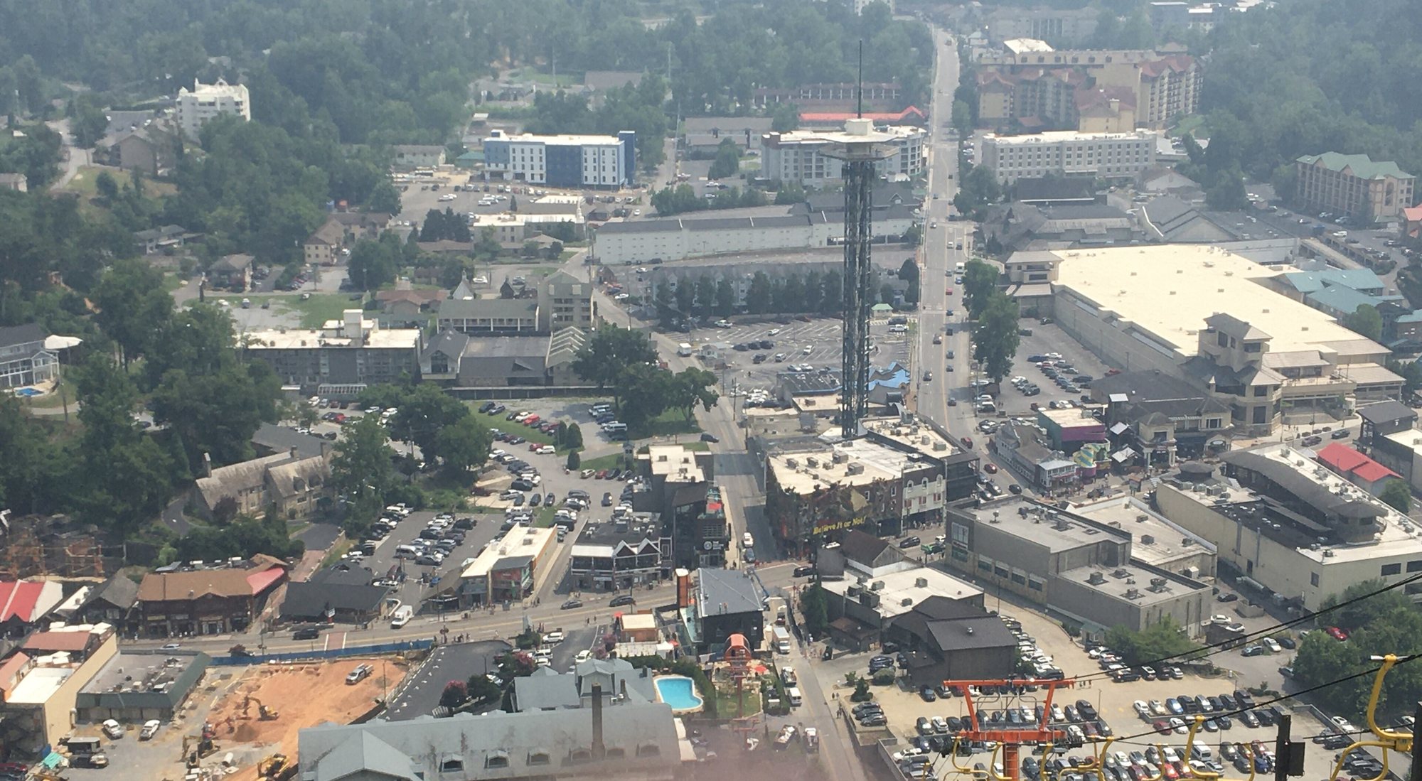 Downtown Gatlinburg and its Space Needle from a chairlift above town, far beyond a short hop's range
