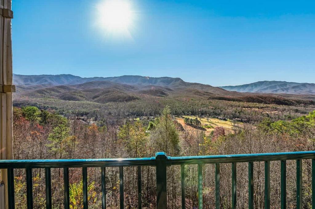 Layered Smoky Mountain ridges beyond the railing · © Hesed Mountain Haven