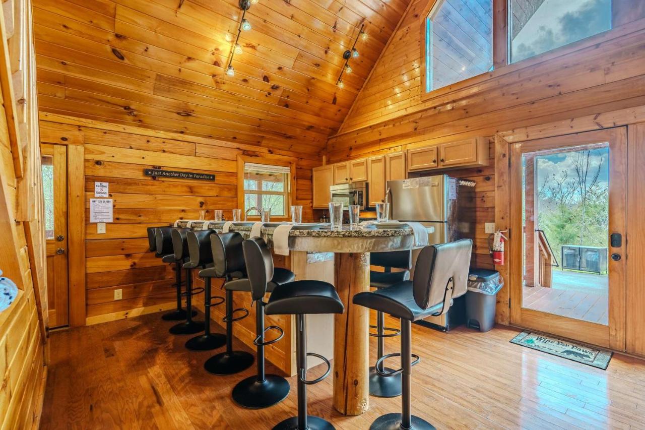 Bar seating under the vaulted pine kitchen · © Lazy Bear Lodge