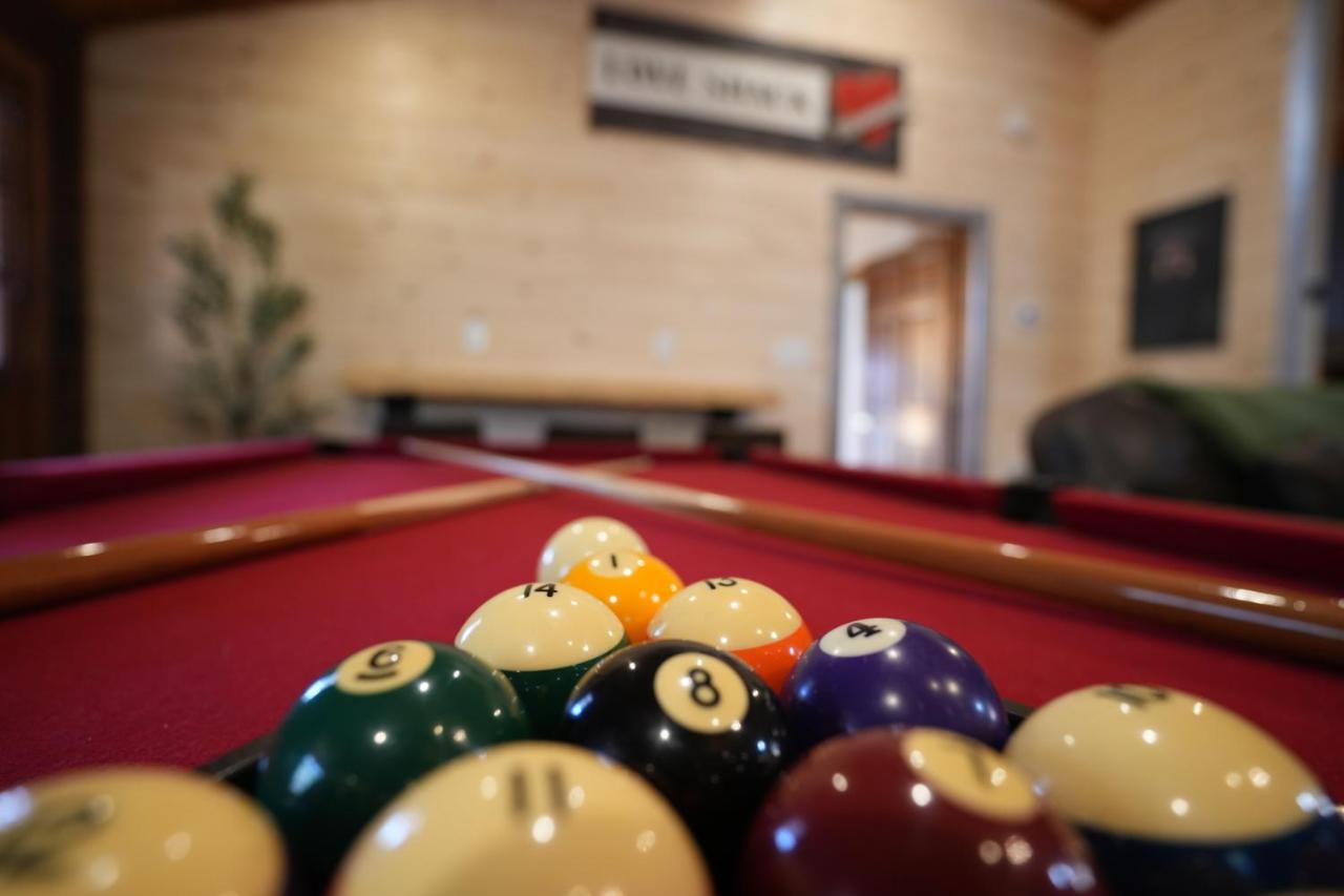Balls racked on the red-felt pool table · © Love Shack