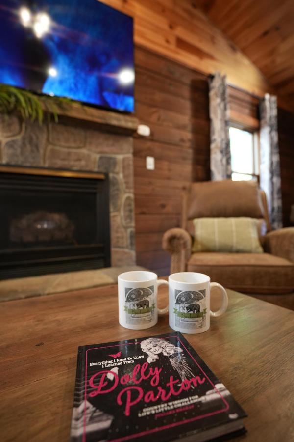 Two mugs and the stone fireplace in the living room · © Love Shack