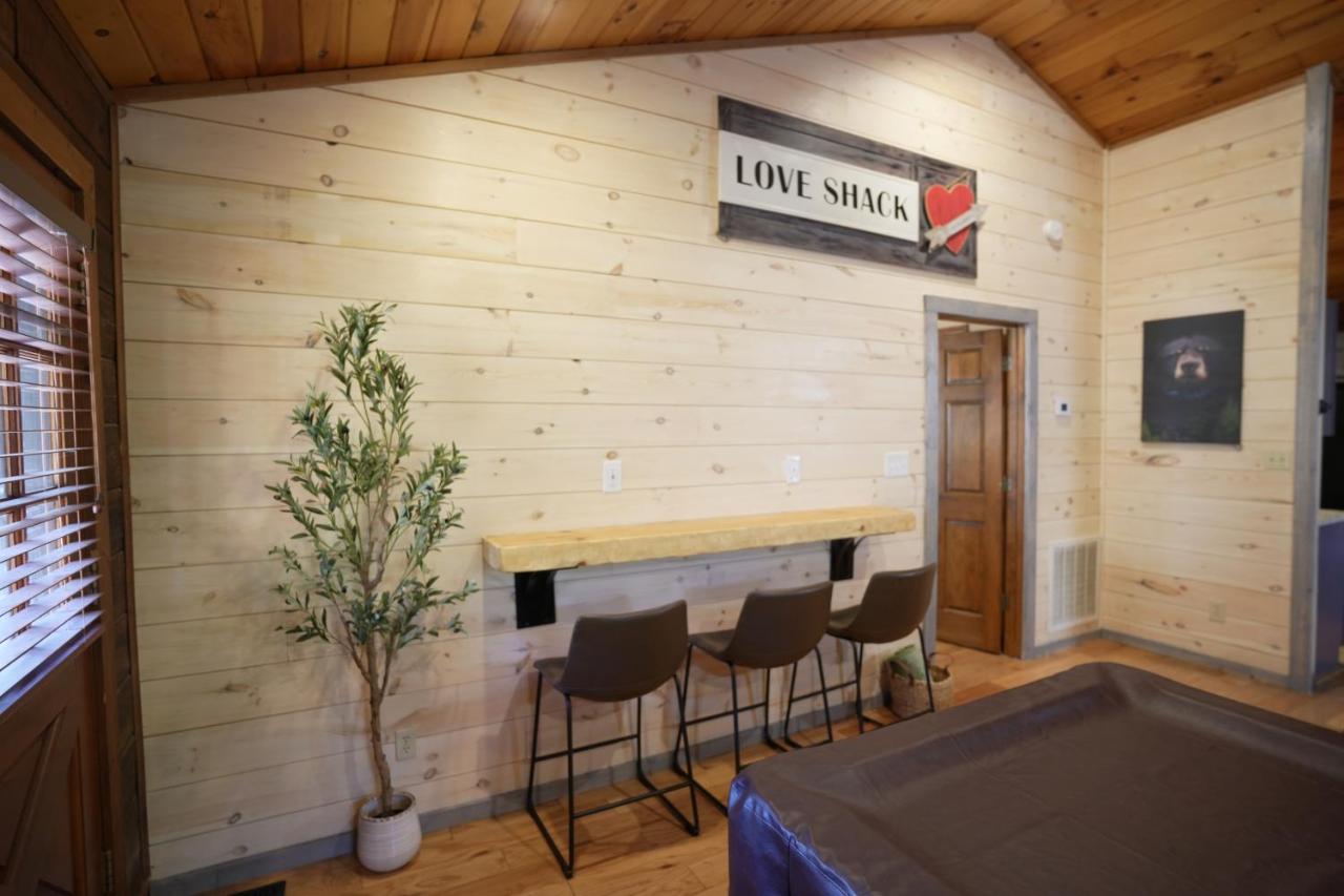 The open living and games space under the Love Shack sign · © Love Shack
