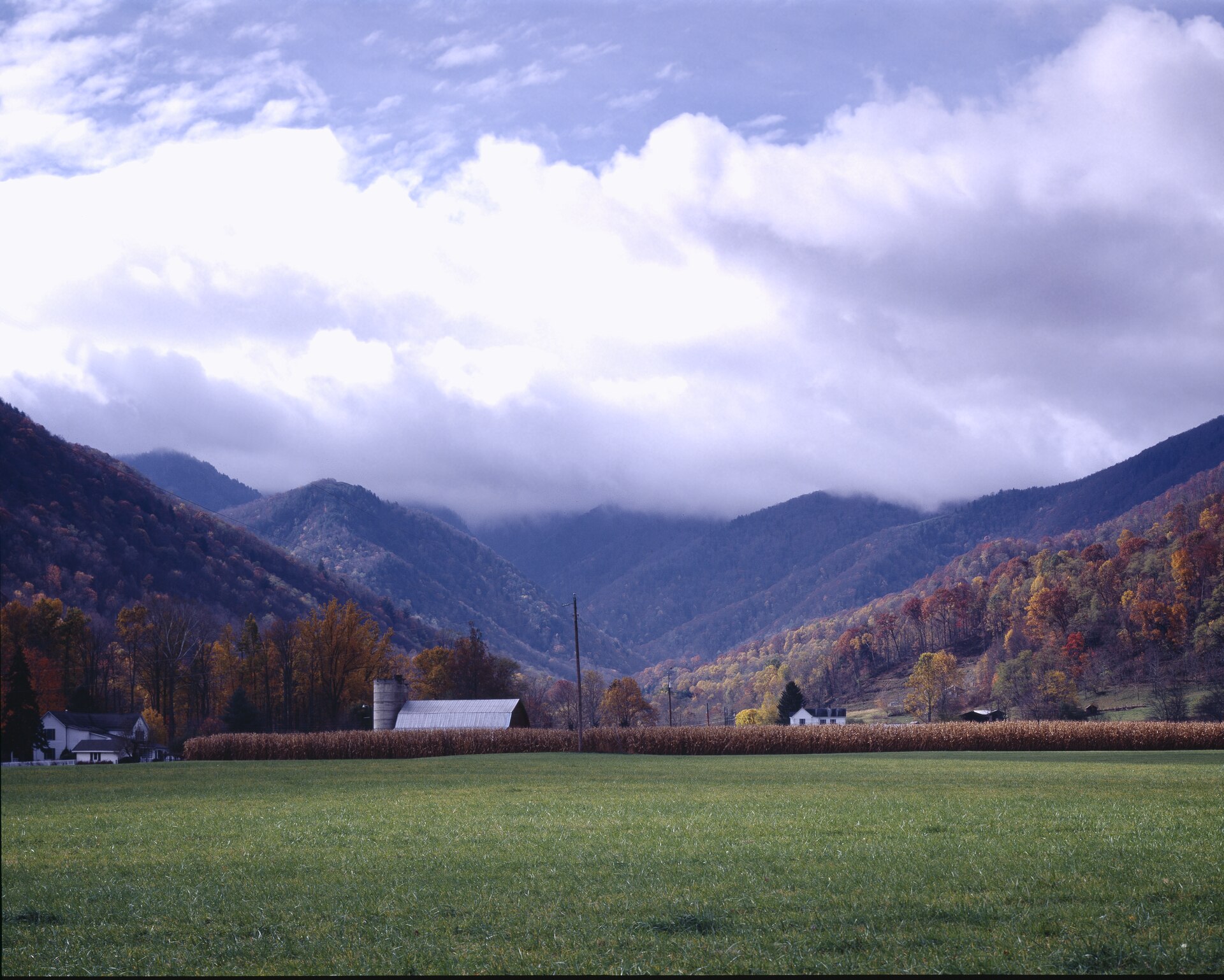 Autumn color and storm clouds over the farms of Maggie Valley