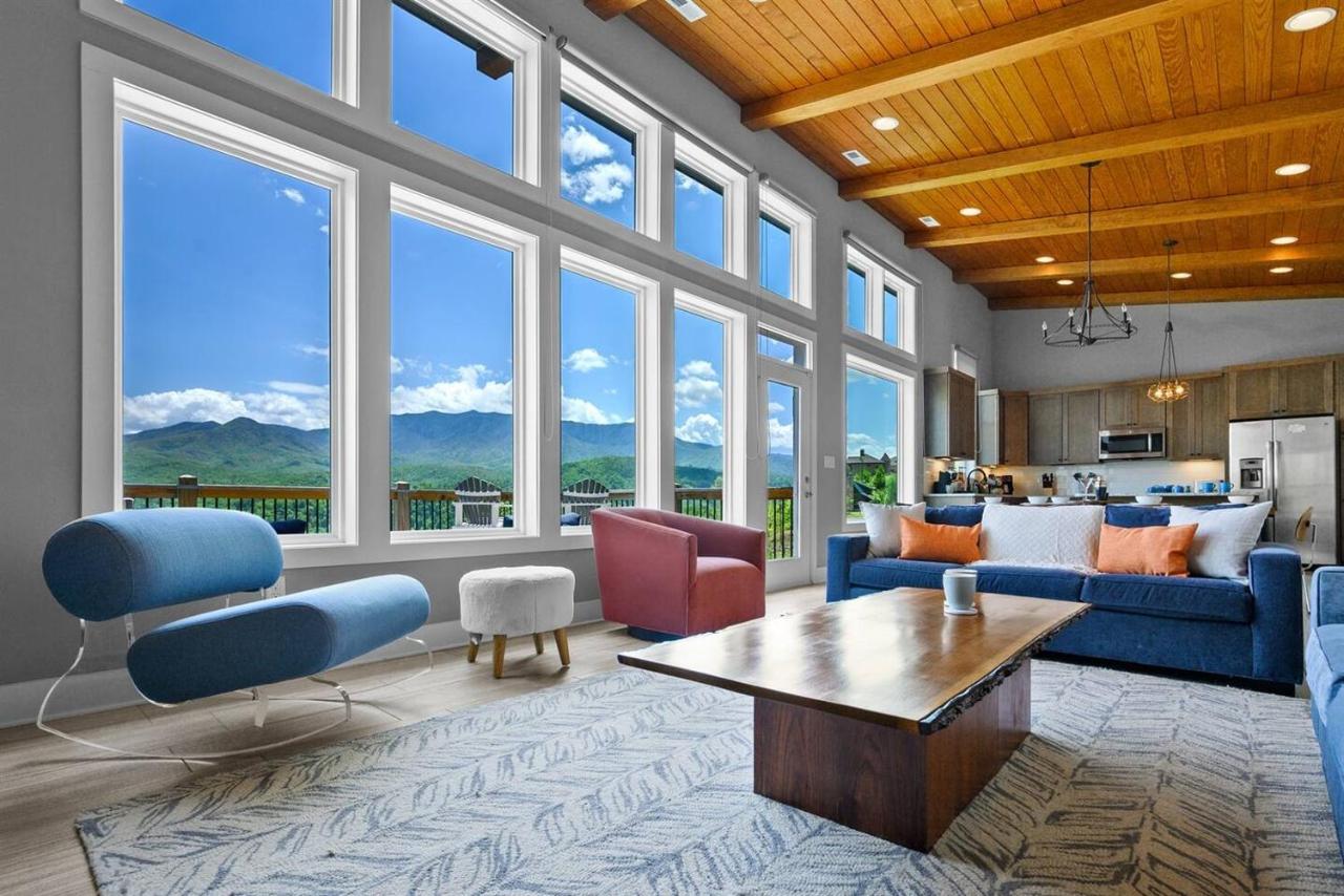 The great room's two-story wall of windows onto the ridge · © The Modern Cabin on Beanstalk Road