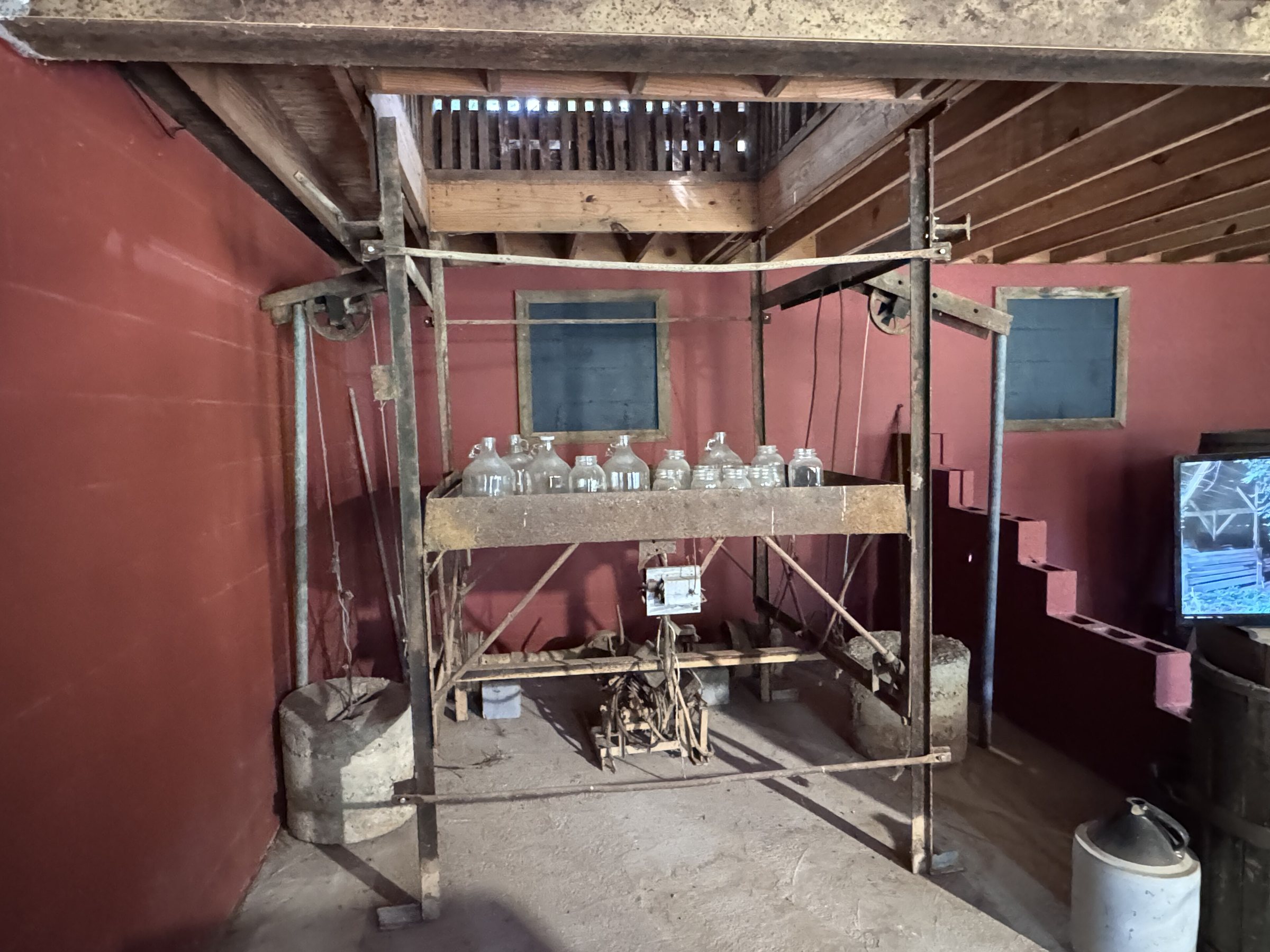 Glass jugs on an old moonshine rig at the Heritage Center in Townsend