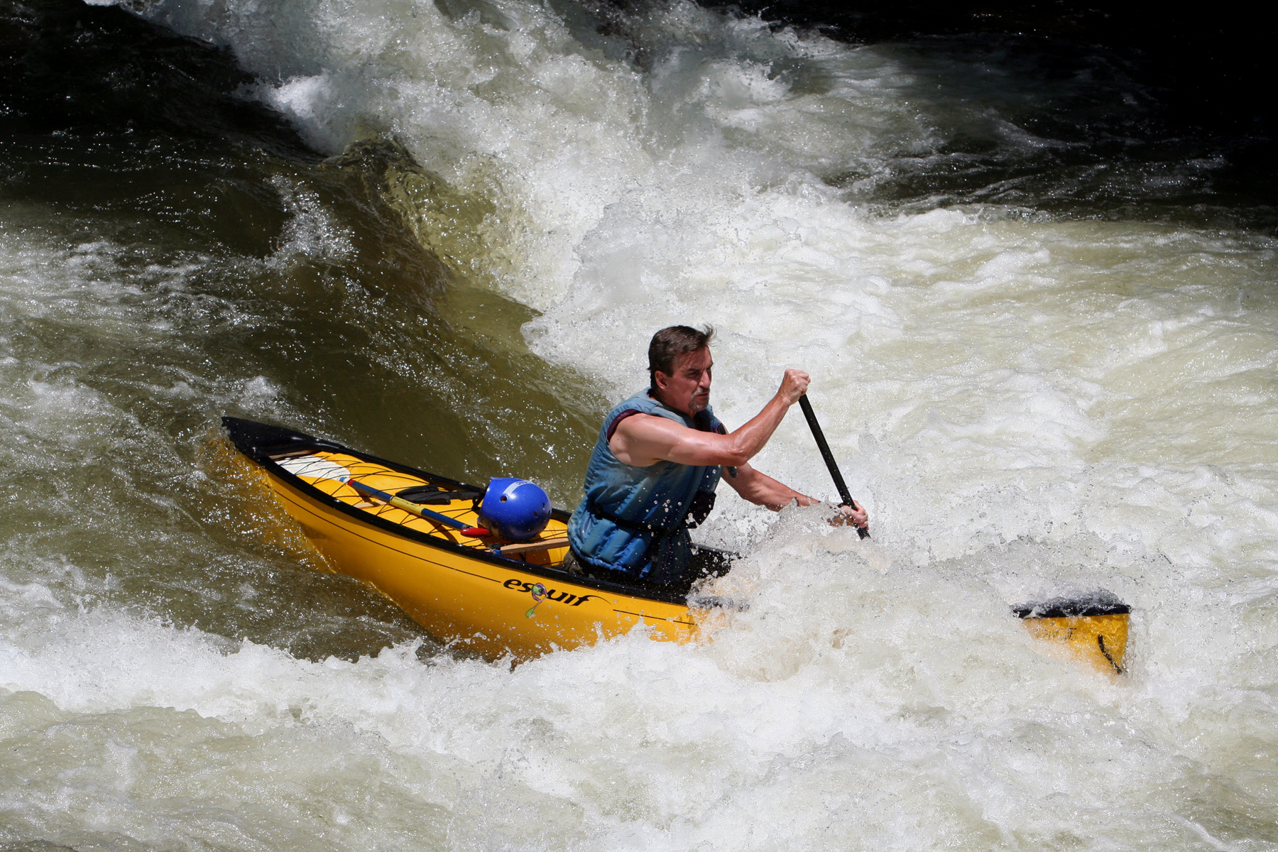 A solo canoeist runs a rapid on the Nantahala River, North Carolina