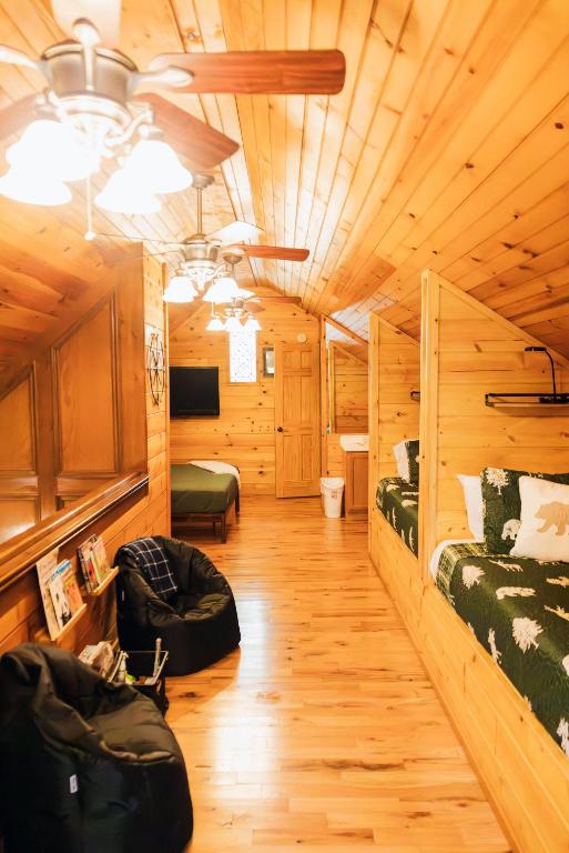 The loft, with built-in beds along one wall and another bed beyond · © Ole Red Retreat
