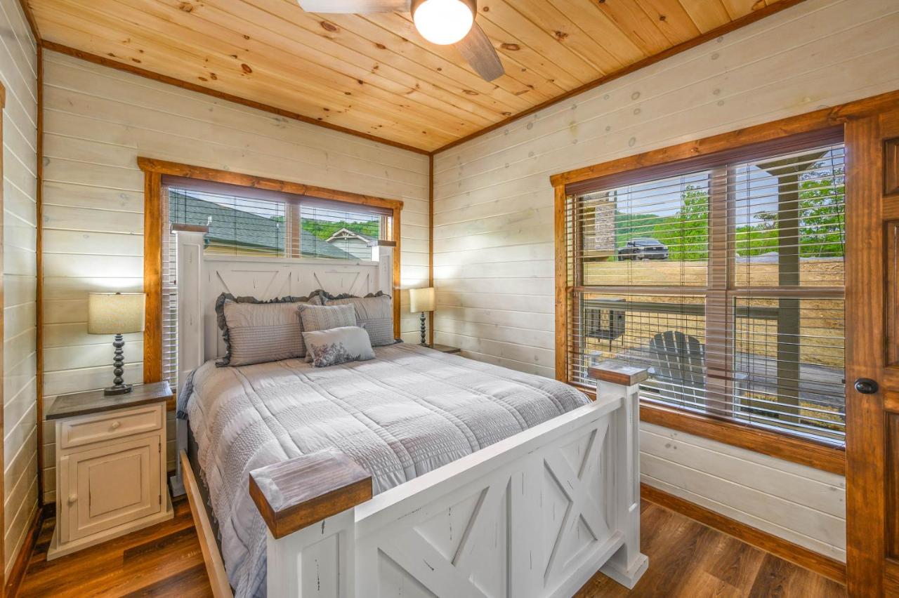A bright bedroom under a pine ceiling with a farmhouse bed · © Osprey Nest Cottage