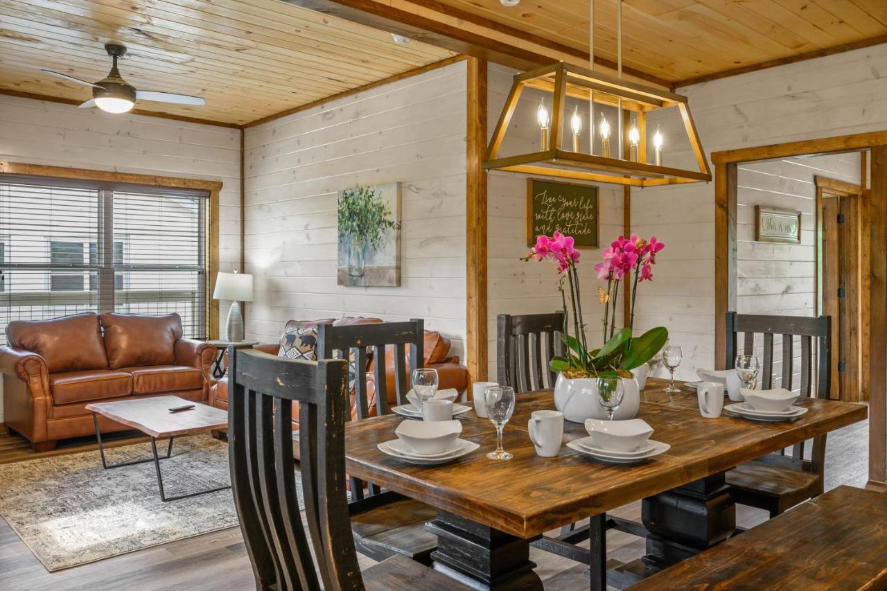 The open dining table and living area set for a group · © Osprey Nest Cottage