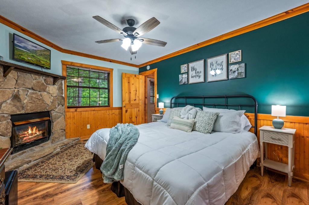 A bedroom with its own stone fireplace · © Serene Escape