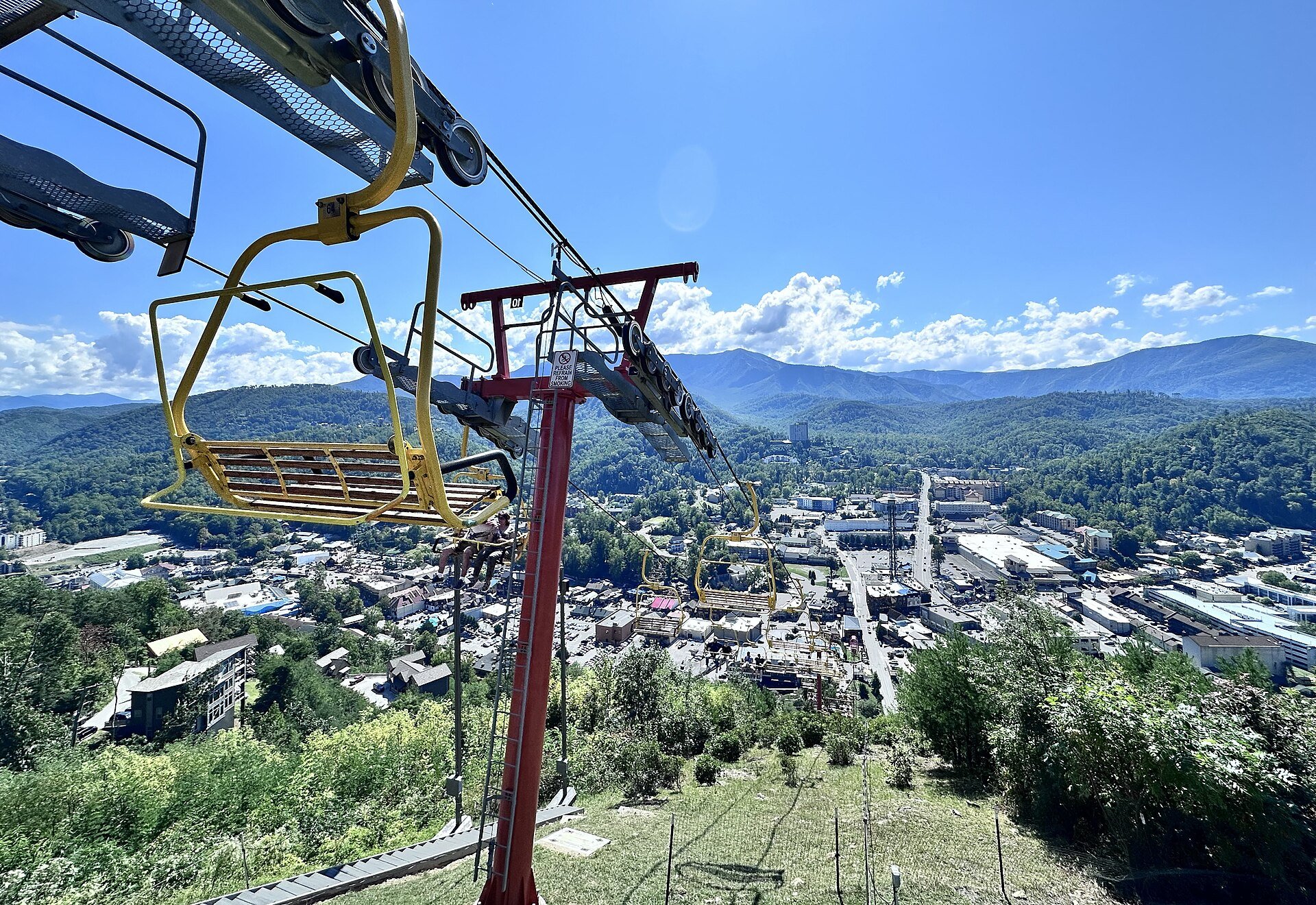The yellow SkyLift chairs climbing above downtown Gatlinburg