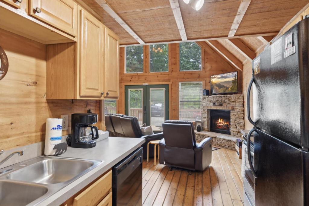 The kitchen opening onto the living room and French doors · © Smoky Oaks