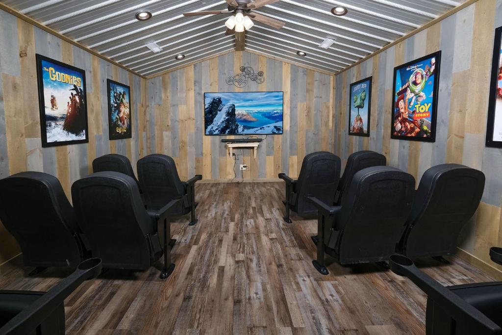 Rows of cinema seats in the private theater · © Splash 'N Heavenly Views
