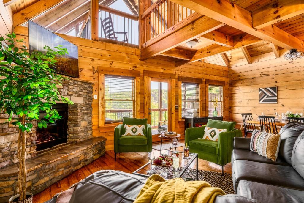 The stone fireplace in the vaulted log living room · © Splashtacular