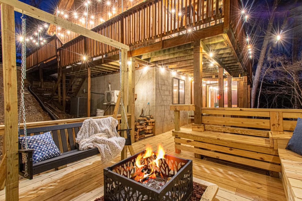 The lower deck with its fire pit, porch swing and bench seating · © The Family Stone
