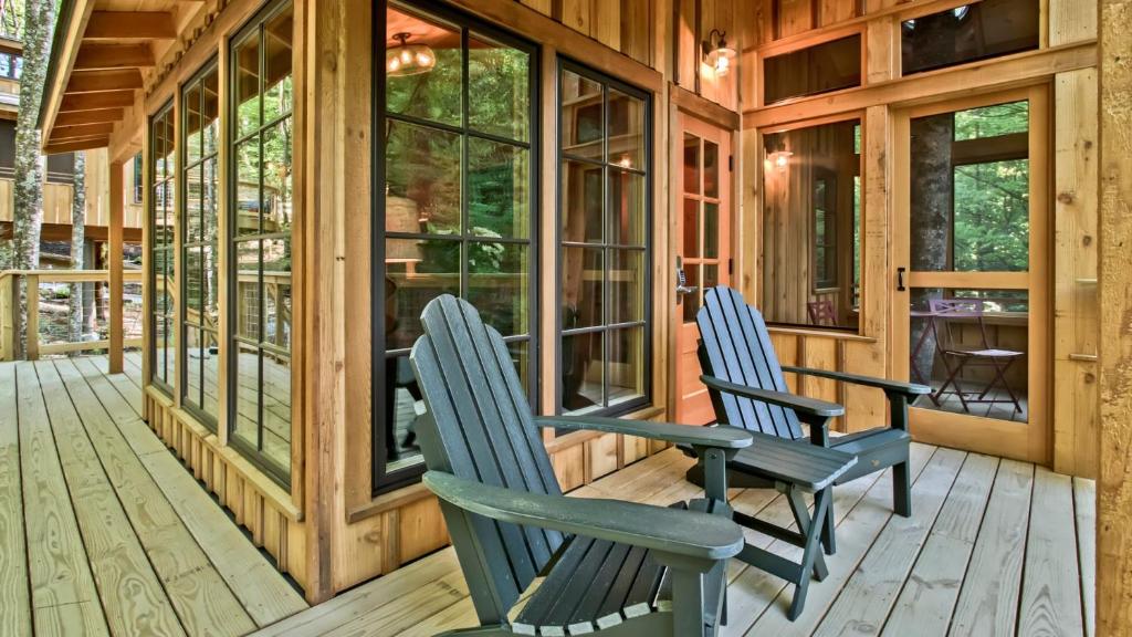 Adirondack chairs on the covered deck · © The Magnolia at Treehouse Grove