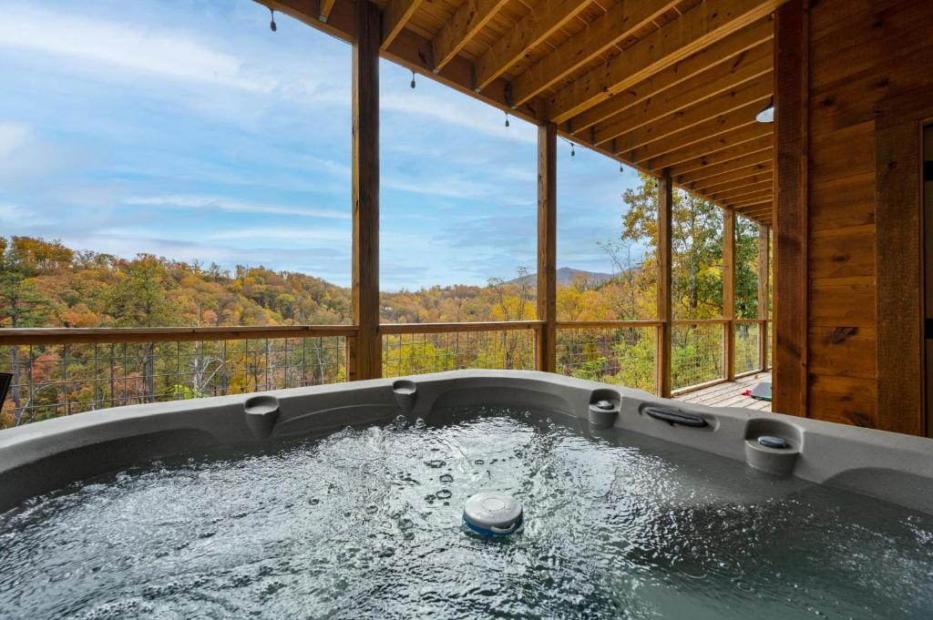 The hot tub under the covered deck, facing the ridges · © The Overlook
