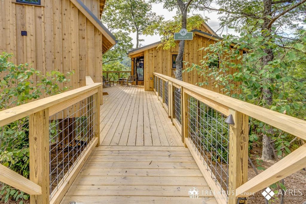 The boardwalk leading up to The Spruce · © The Spruce at Treehouse Grove