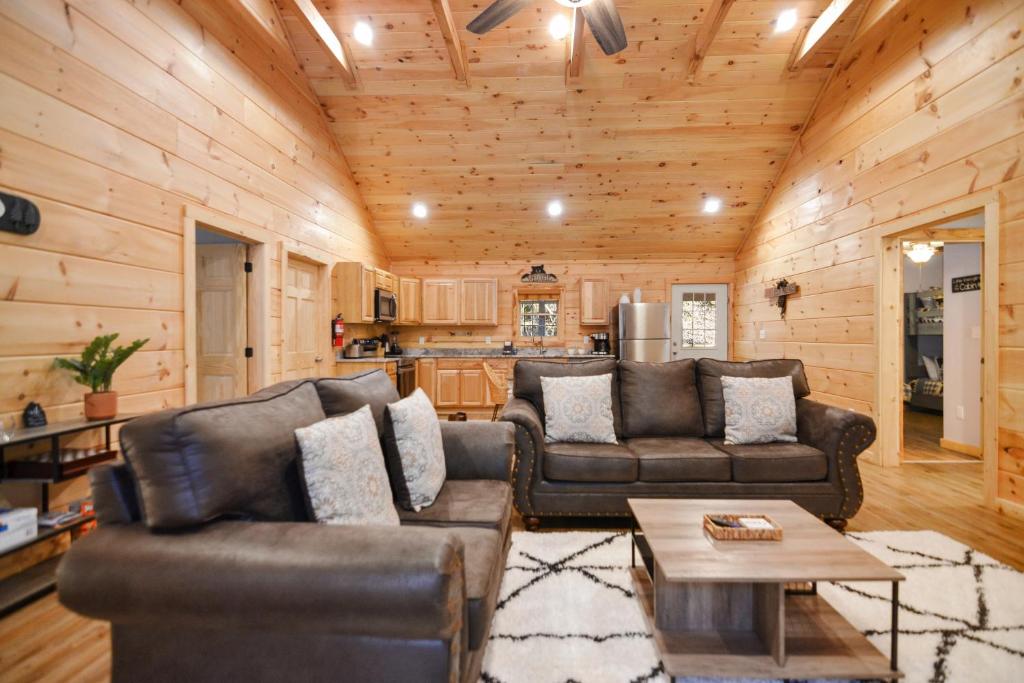 The open-plan great room running back to the kitchen · © Tsaliwood Cabin