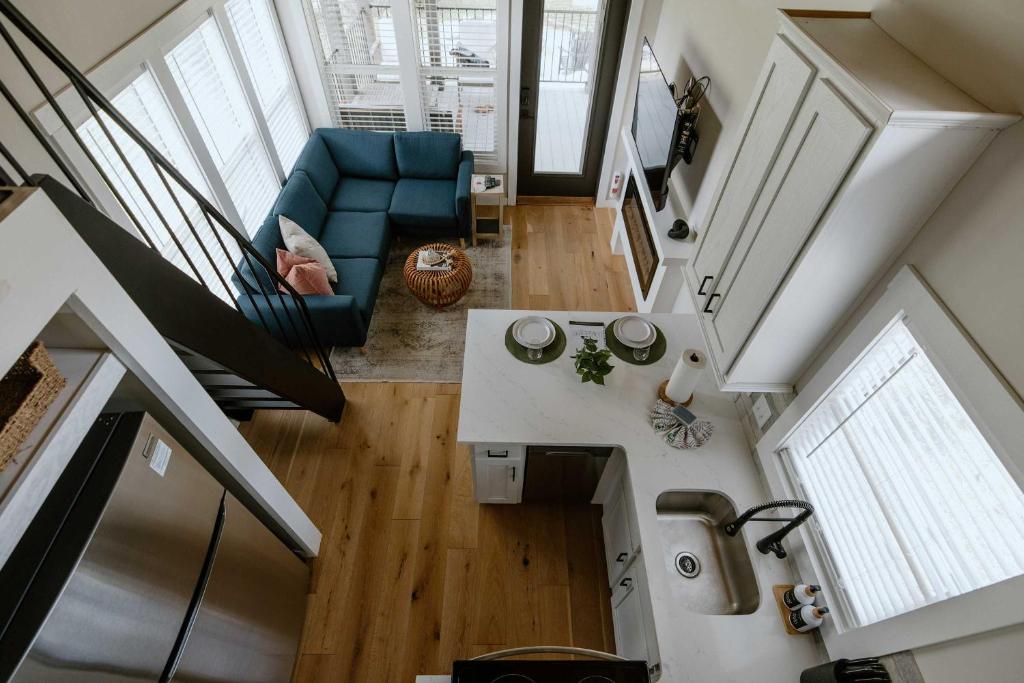 Looking down from the loft over the kitchen island and living area · © Willow Cabin